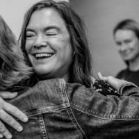 Joyous hug with the Emerging Professional award winner